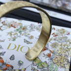 Dior gold-tone cuff bracelet with engraved DIOR lettering on the inside