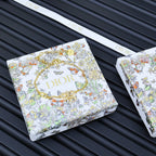Gold-tone bracelet on floral printed Dior gift cards