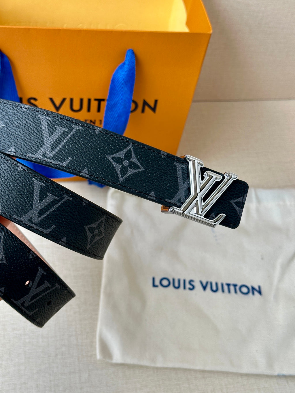 Louis Vuitton monogram belt with silver buckle and printed dark strap