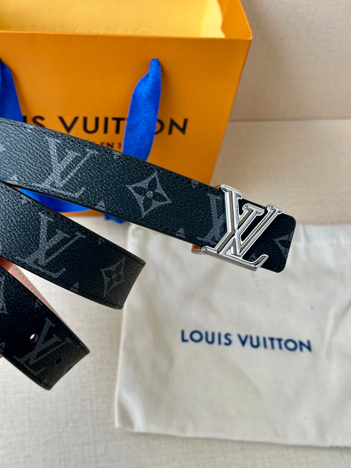 Louis Vuitton monogram belt with silver buckle and printed dark strap