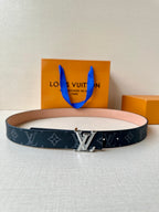 Louis Vuitton monogram belt with silver-toned buckle and dark canvas strap