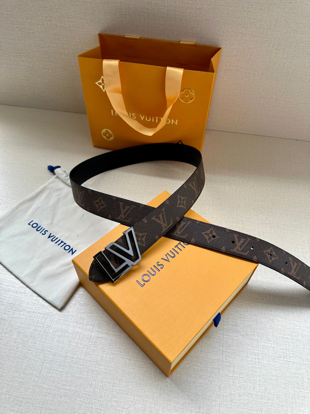Louis Vuitton monogram belt with LV gold buckle, dark brown strap