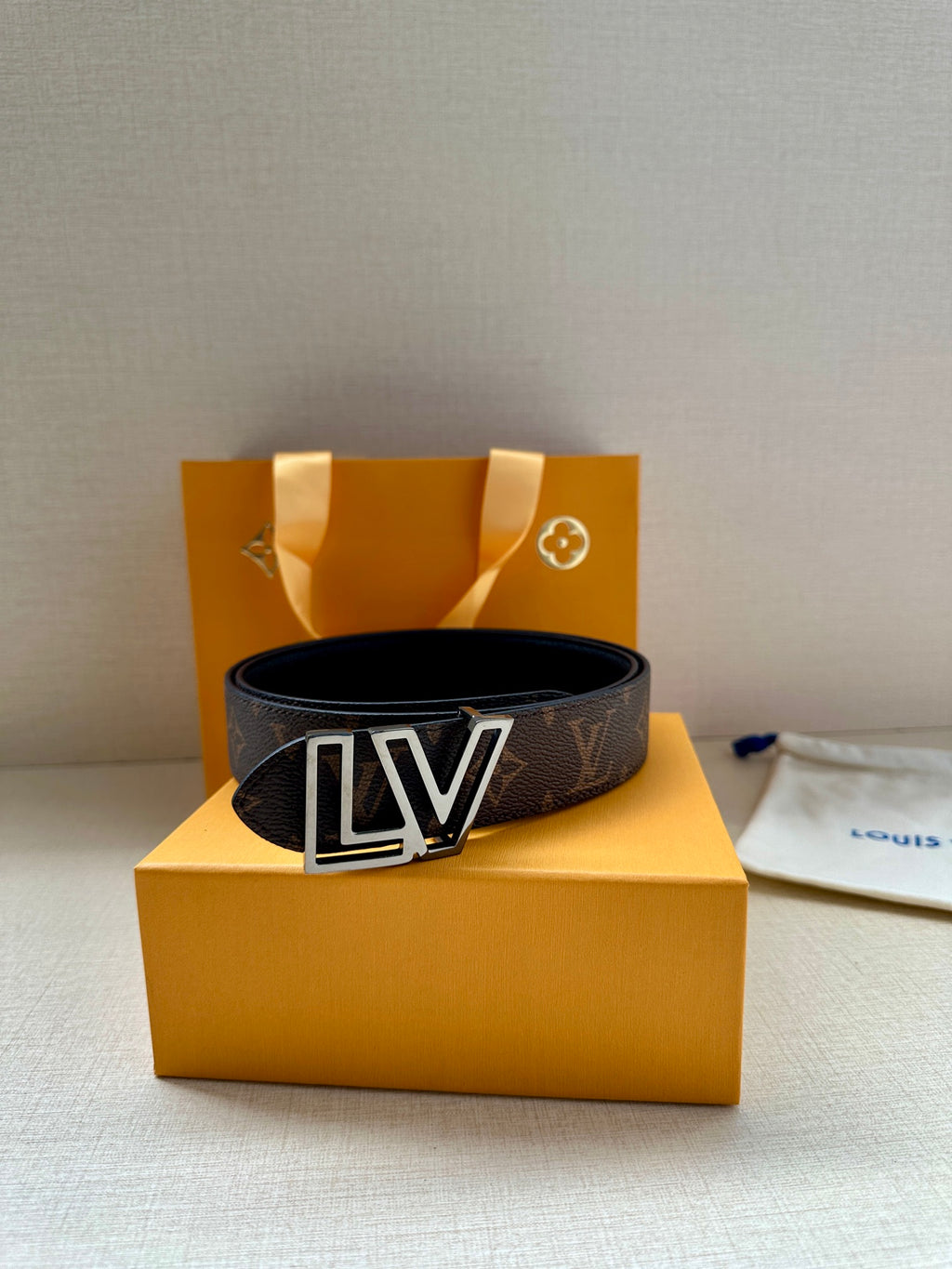 Louis Vuitton monogram belt with LV gold buckle on dark brown strap
