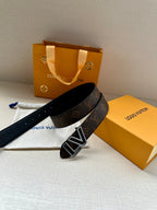 Louis Vuitton belt with LV silver buckle on dark monogram strap