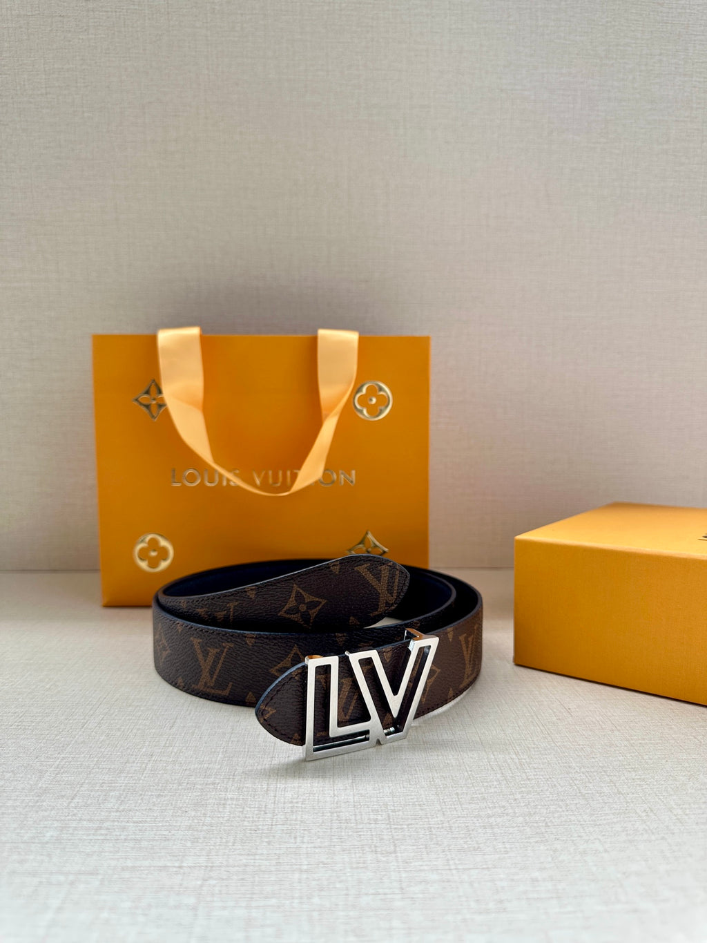 Louis Vuitton monogram belt with LV gold buckle on dark brown strap