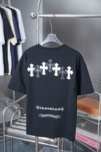 Black short-sleeve T-shirt with row of white cross graphics and small text