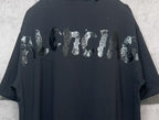 Balenciaga dark T-shirt with large animal-style graphic on back