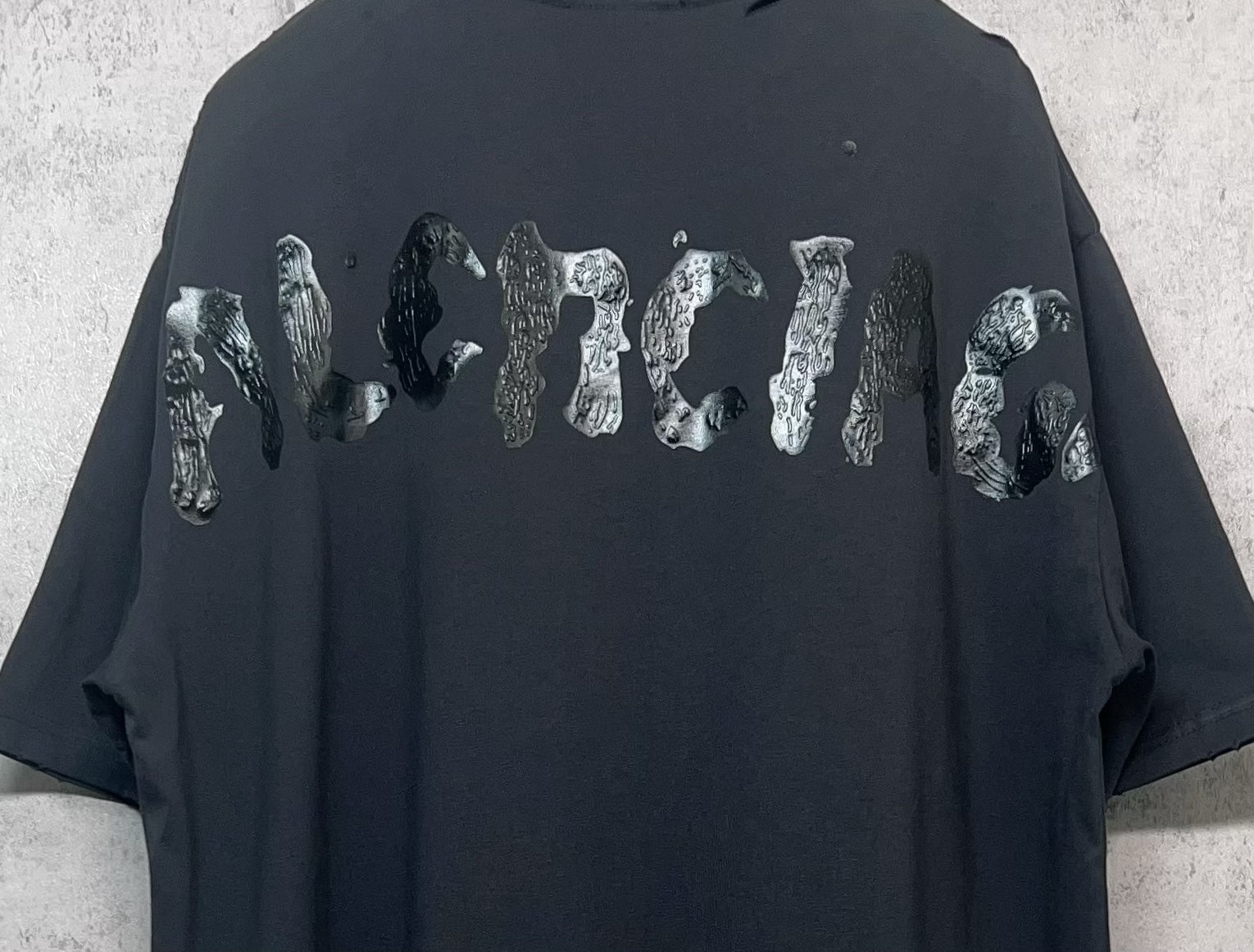 Balenciaga dark T-shirt with large animal-style graphic on back