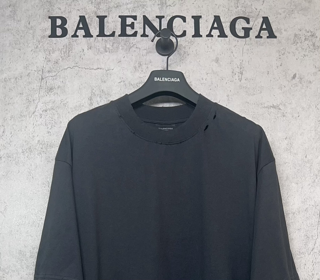 Balenciaga dark crew-neck T-shirt close-up