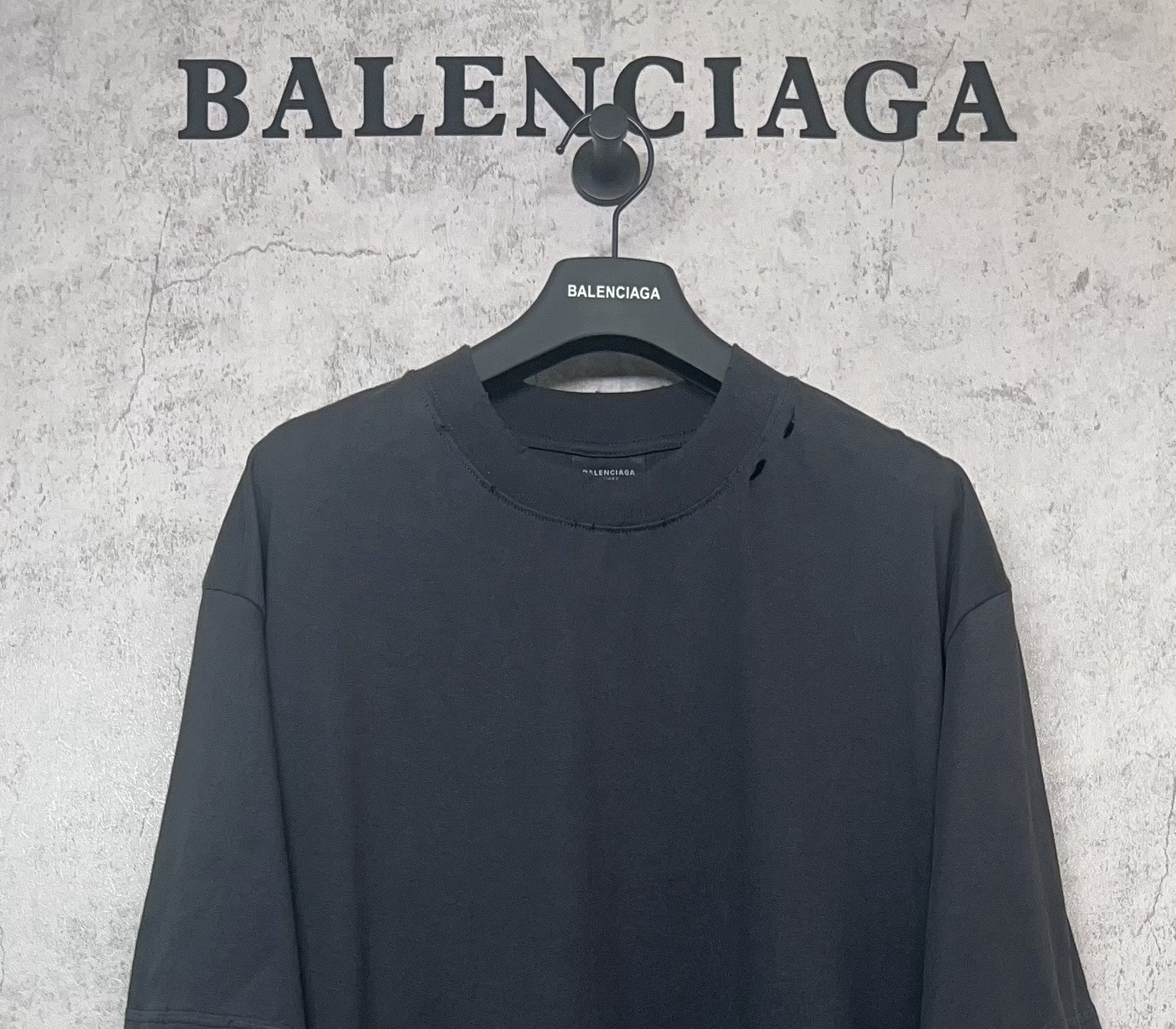 Balenciaga dark crew-neck T-shirt close-up