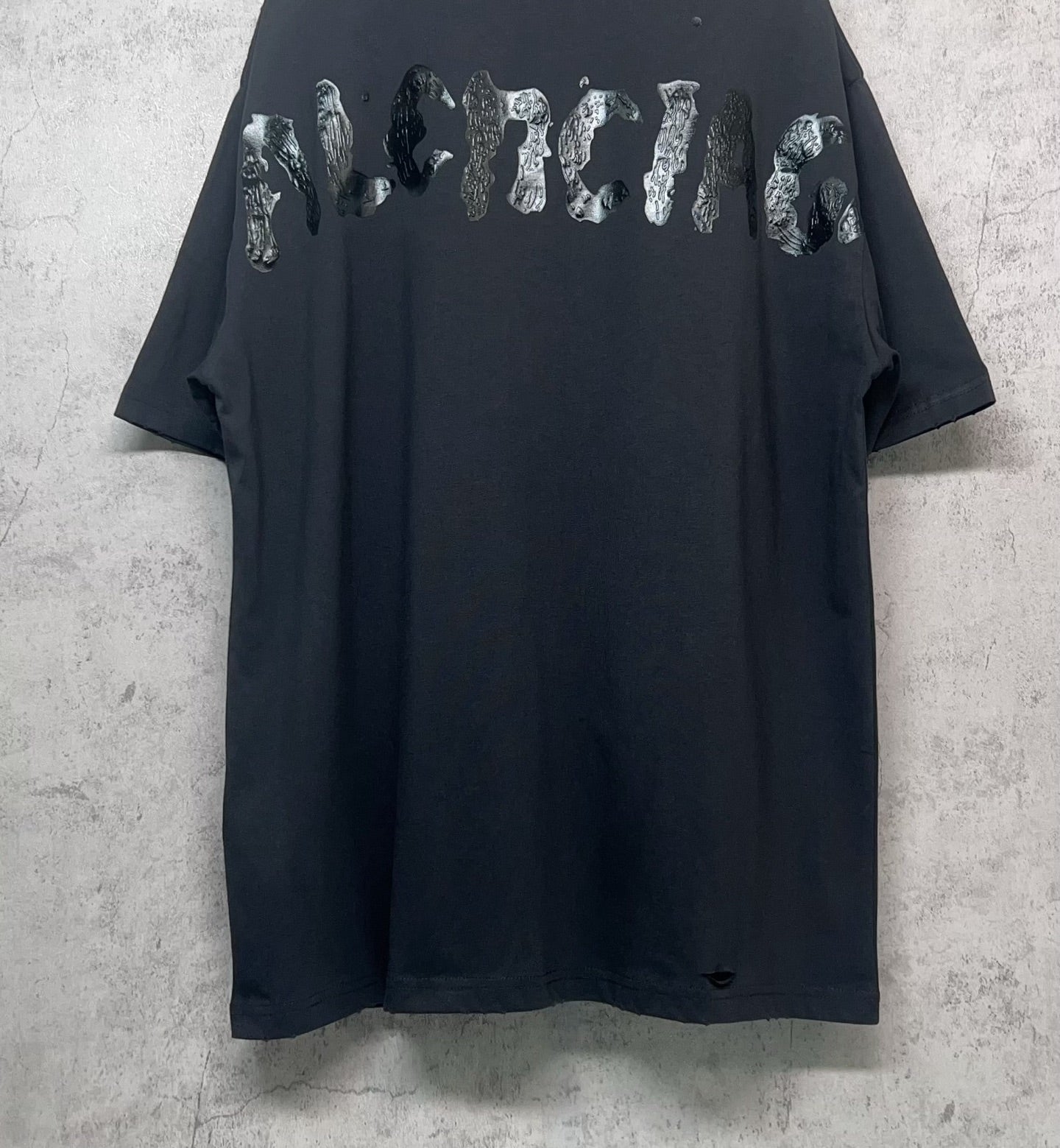 Balenciaga dark T-shirt with wide animal-style graphic across back