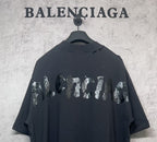 Balenciaga dark T-shirt with animal-style graphic across the back