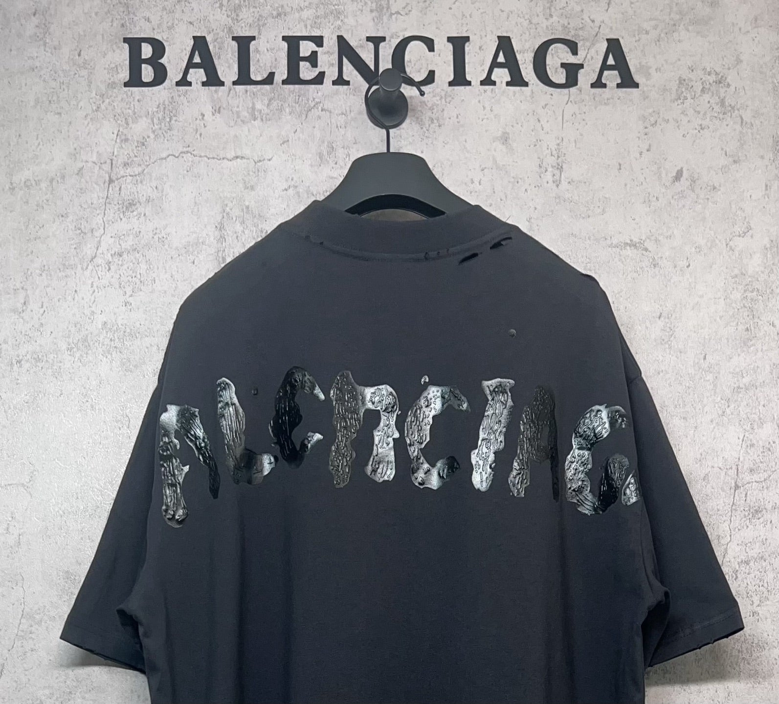 Balenciaga dark T-shirt with animal-style graphic across the back