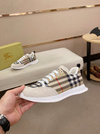 Plaid canvas low-top sneaker with white sole and lace-up front, side view.