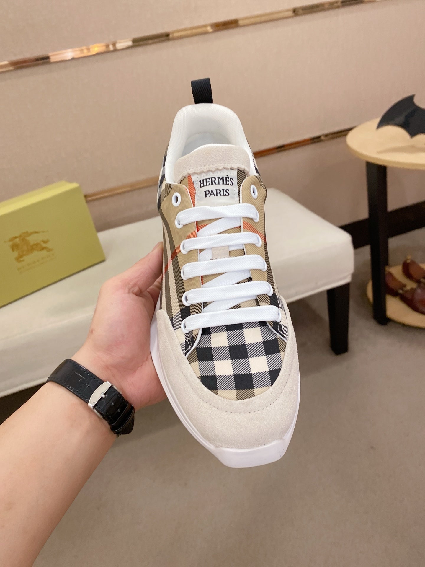 Canvas low-top sneakers with beige panels, navy-red plaid detail, and white laces.