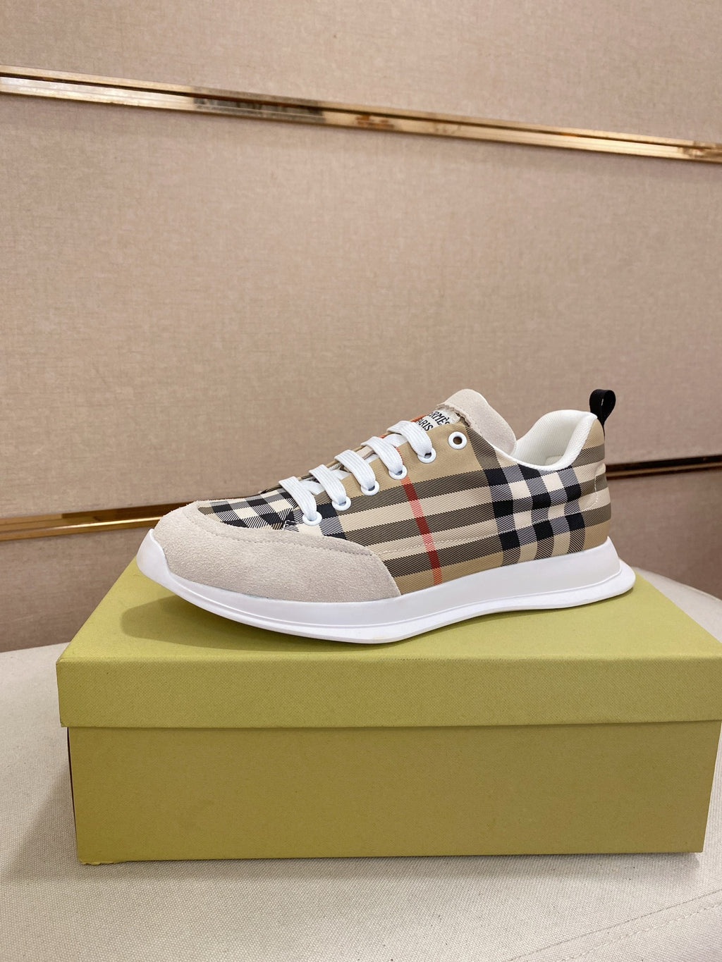 Checkered canvas low-top sneakers with white toe cap and lace-up front.