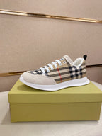 Checkered canvas low-top sneakers with white toe cap and lace-up front.