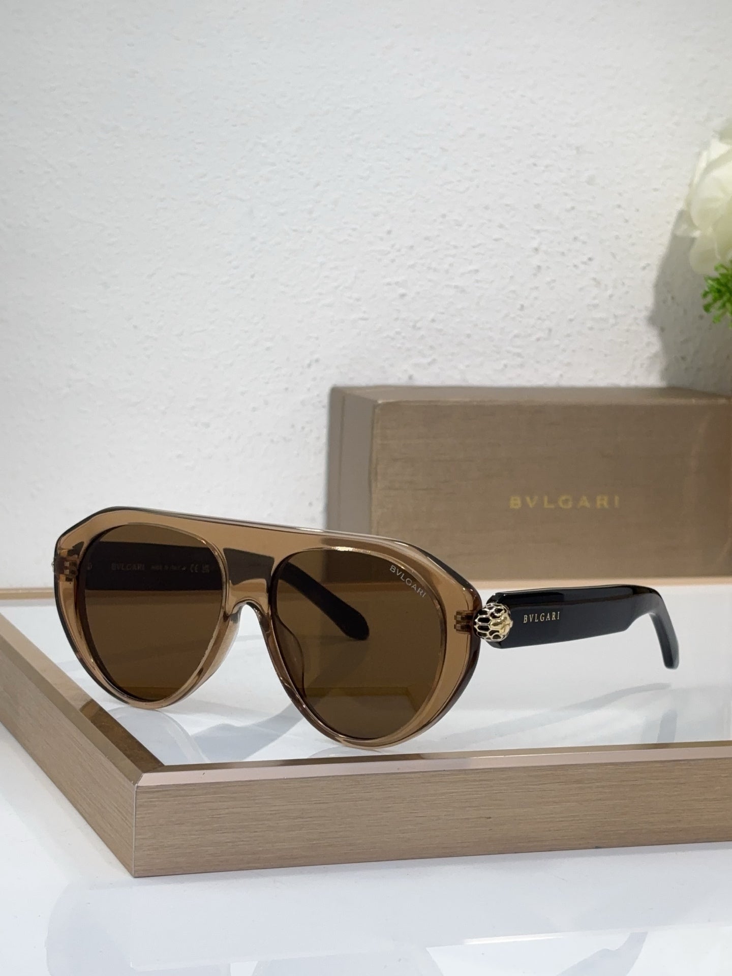 Bvlgari sunglasses with tortoise-brown frames and brown mirrored lenses, round cat-eye style