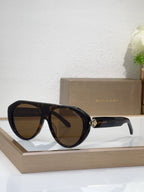 Bvlgari sunglasses with black frames and brown-tinted mirrored lenses, round cat-eye style