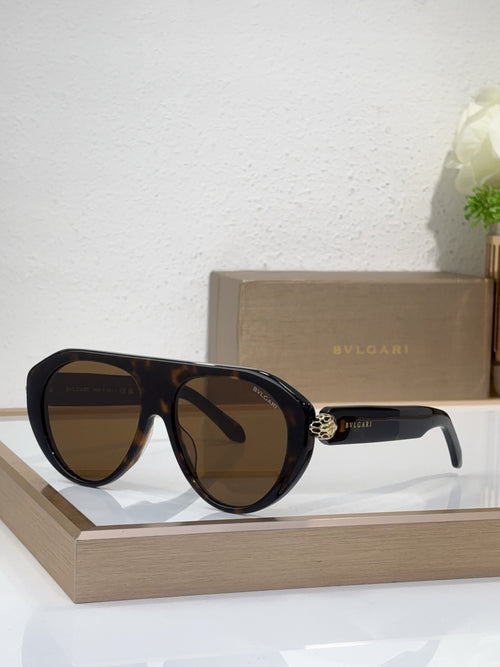 Bvlgari sunglasses with black frames and brown-tinted mirrored lenses, round cat-eye style