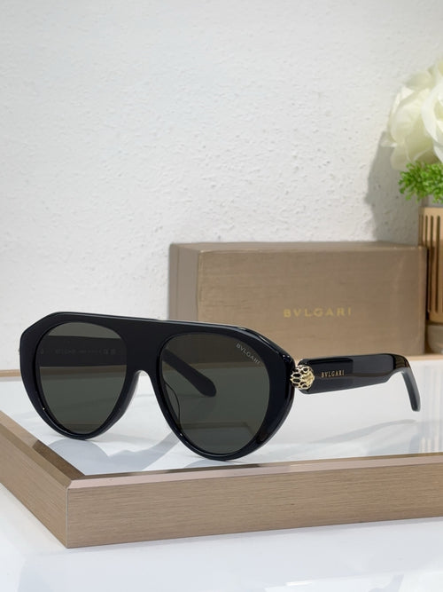 Bvlgari sunglasses with black frames and dark mirrored lenses, round cat-eye style