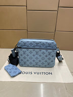 Light blue monogram crossbody bag with adjustable strap and matching pouch