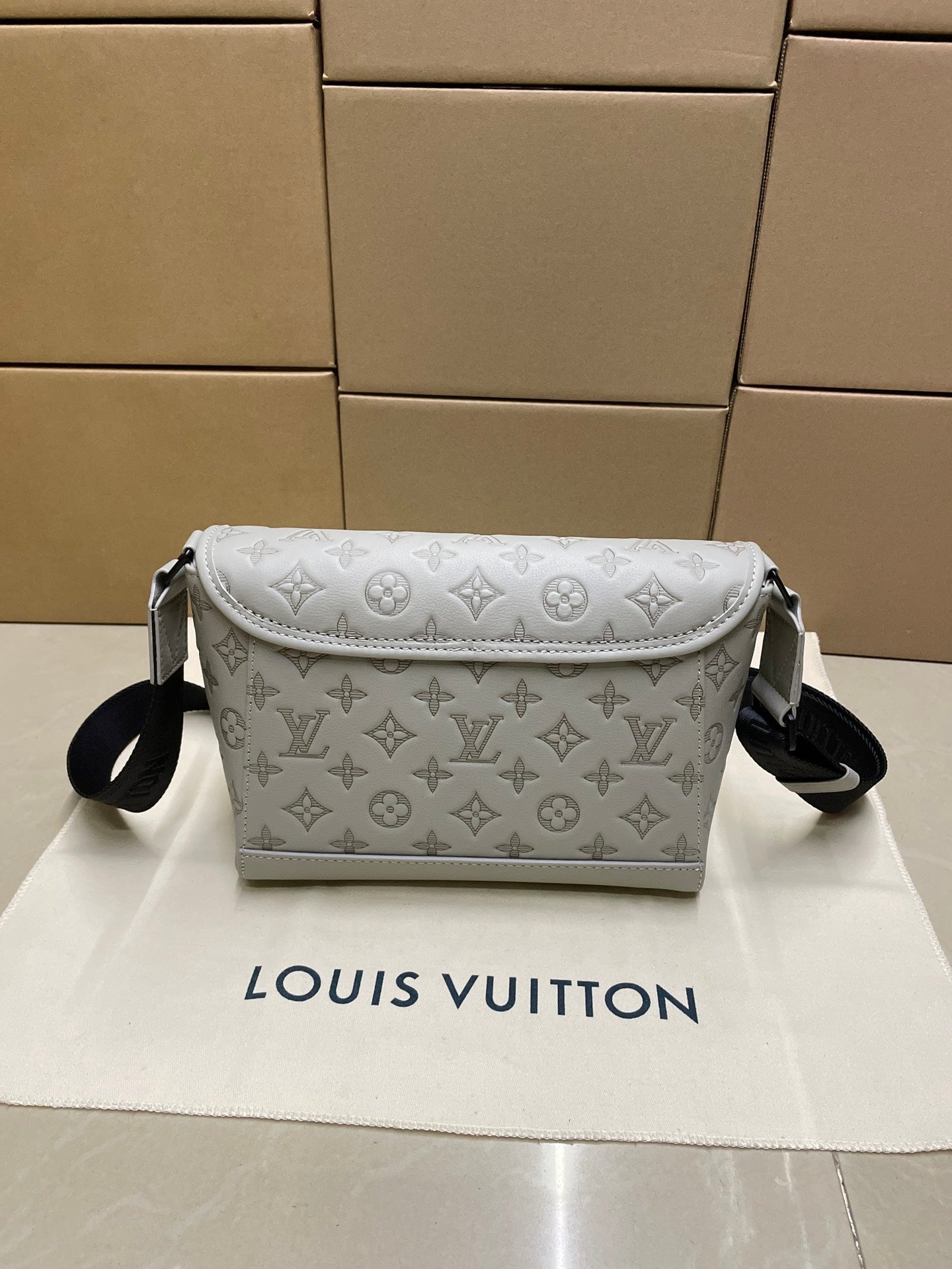 Louis Vuitton men’s crossbody bag, light monogram canvas with front flap and black strap