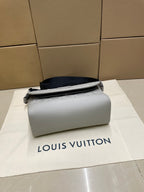 Louis Vuitton crossbody bag in light gray with top handle and minimal front pocket