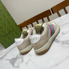 Cream Gucci unisex sneakers, back view with heel patch and striped detail
