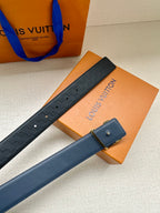Blue embossed leather belt with silver LV logo buckle and perforated strap holes.