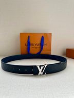Blue embossed leather belt with silver LV logo buckle.