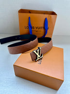 Louis Vuitton embossed tan leather belt with gold-tone LV buckle and strap