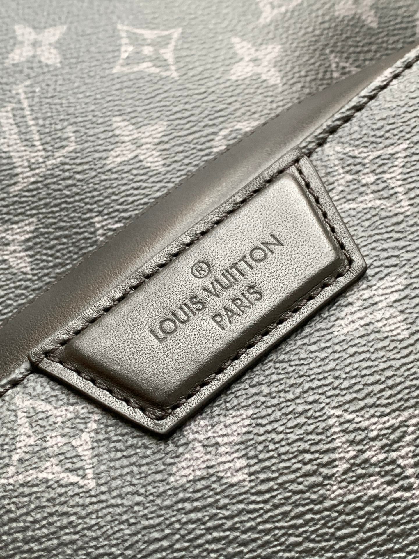Louis Vuitton leather brand patch detail on dark monogram backpack