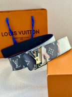Louis Vuitton monogram belt in blue with multicolor patch pattern and gold buckle.