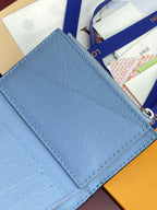 Light blue Louis Vuitton small bag with stitched edge and monogram flap corner detail