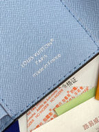 Light blue Louis Vuitton small bag with textured leather and stitched interior edge