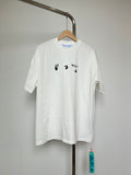 Off-white T-shirt with small blue-and-black graphic icons on chest