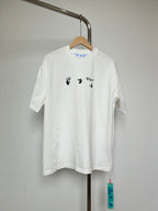 Off-white T-shirt with small blue-and-black graphic icons on chest