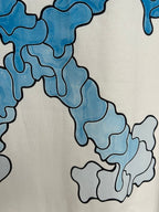 Off-white T-shirt detail of blue printed abstract shapes and lines