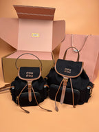 MiuMiu small flap backpacks, black with top handles and adjustable shoulder straps