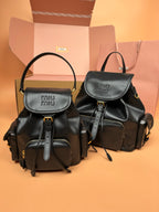 MiuMiu small flap backpacks, black with top handles and adjustable shoulder straps