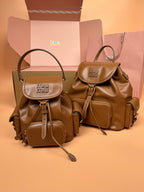 MiuMiu small flap backpacks, tan and brown with top handles and adjustable straps