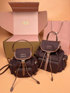 MiuMiu small flap backpacks, dark brown and charcoal with top handles and adjustable straps