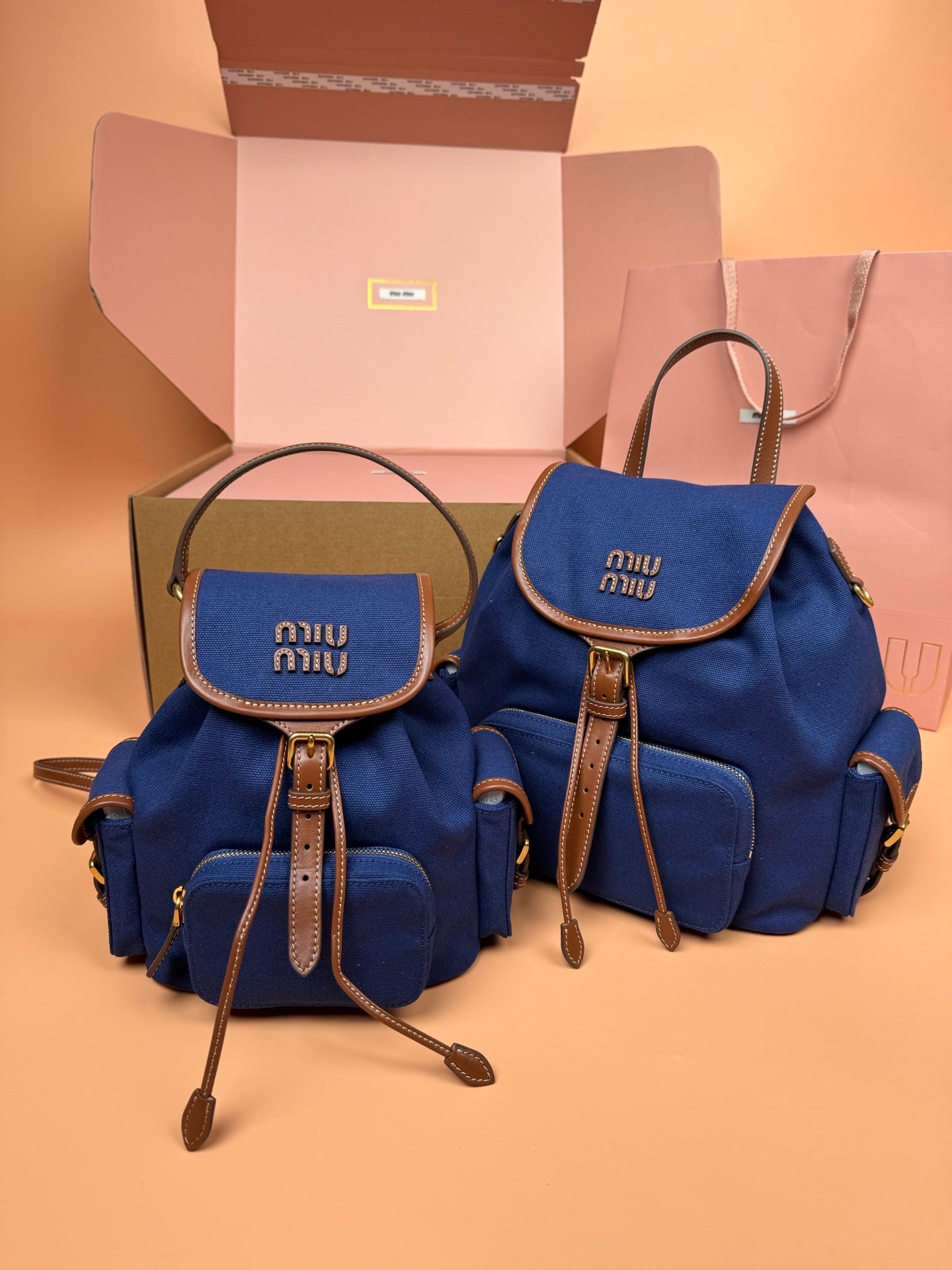 MiuMiu small flap backpacks, royal blue with top handles and adjustable straps