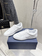 White Dior unisex sneakers, side view pair with lace-up and low profile