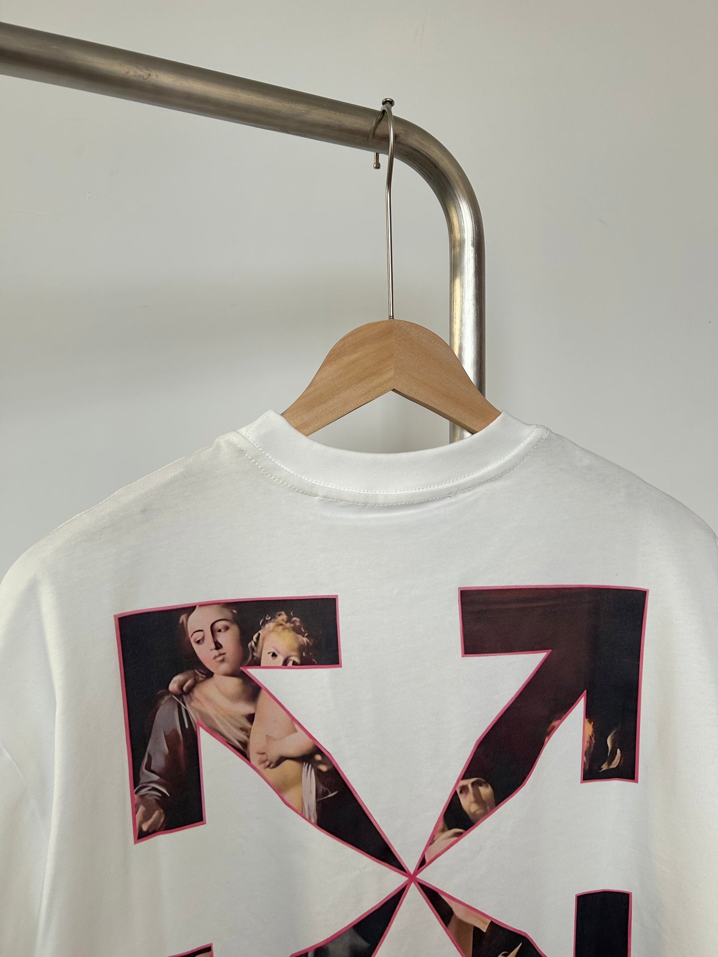 Off White T-shirt back view with large black X collage graphic and photo panels