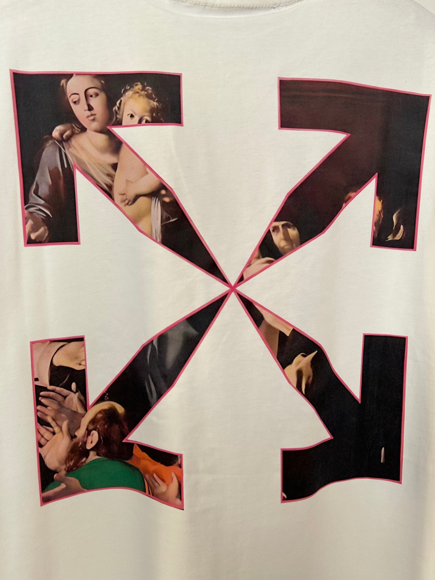 Off White T-shirt back graphic close-up with black X and multiple photo cutouts