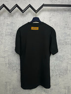 Louis Vuitton black short-sleeve T-shirt, back view on hanger