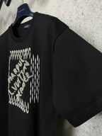 Louis Vuitton black short-sleeve T-shirt with rhinestone logo on chest, side view