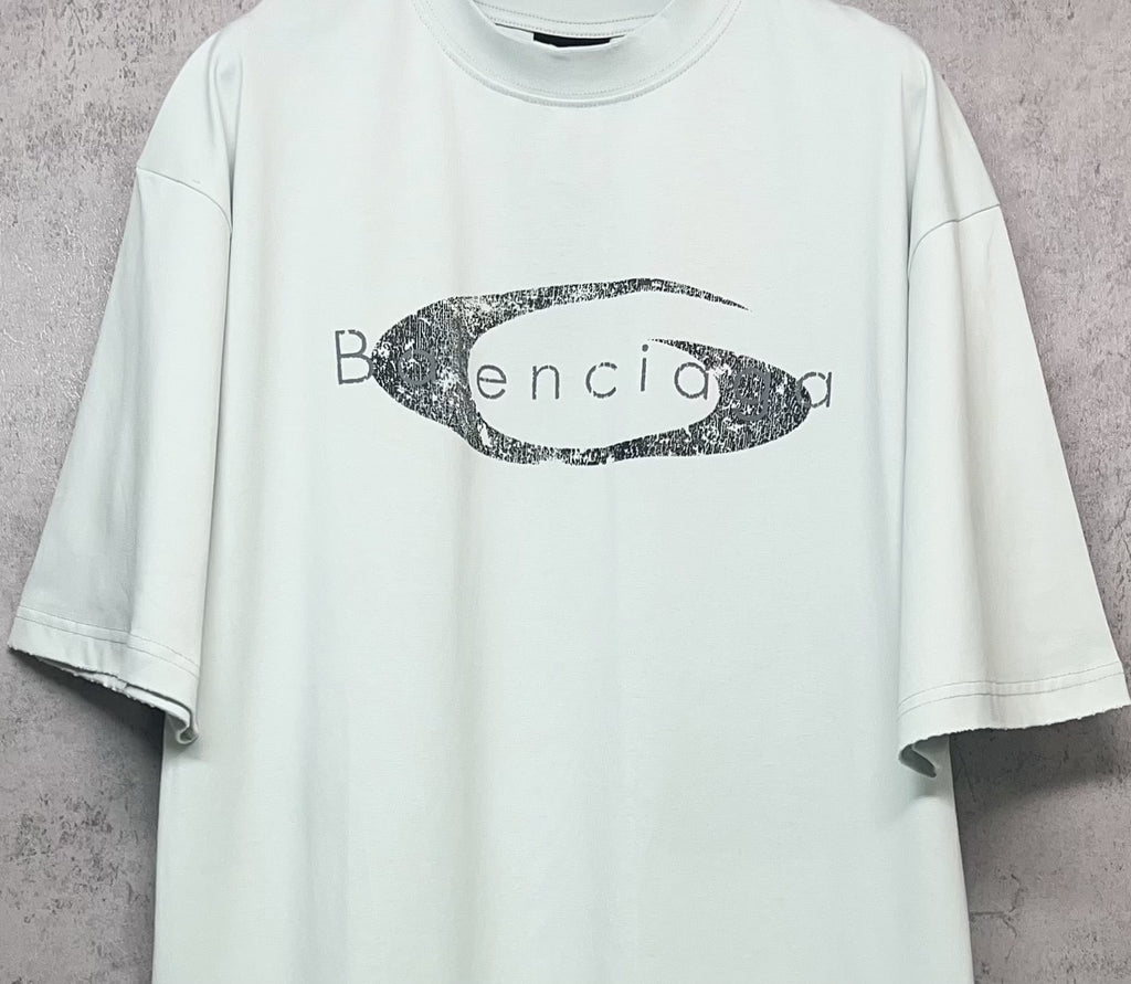 Balenciaga short-sleeve T-shirt in light mint with oval graphic logo print, front close-up